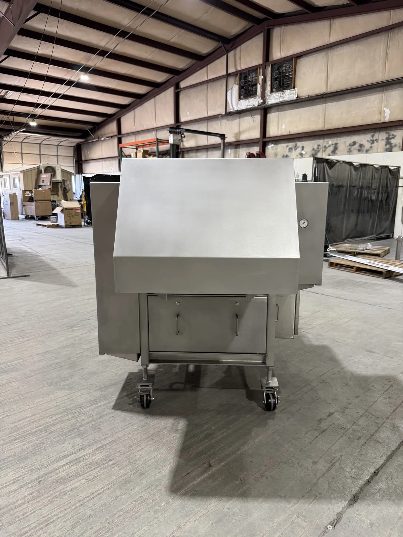 Rear view of stainless equipment enclosure on casters