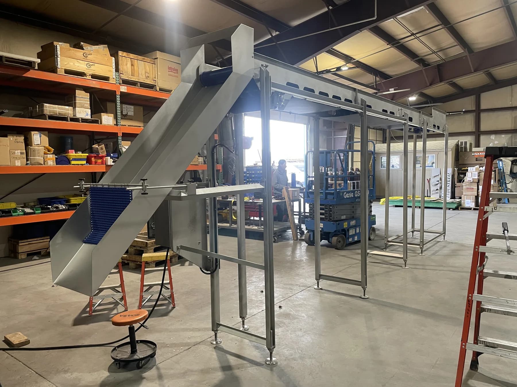Full elevated conveyor system with modular belt and structural supports